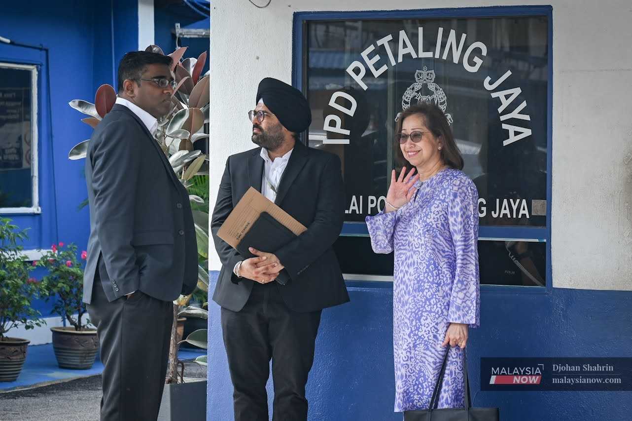 Rajesh_Sachpreetraj_Naimah_20240930_Mnow Lawyers Rajesh Nagarajan and Sachpreetraj Singh with Naimah Khalid after filing a police report in Petaling Jaya on Sept 30, 2024.