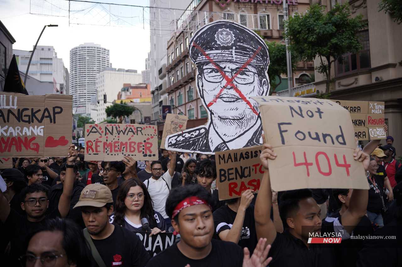 People march in Kuala Lumpur calling for the arrest of MACC chief Azam Baki on Feb 15, 2026.