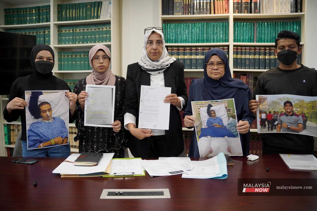 Lawyers Sharifah Rania Aljunied and Latheefa Koya (second and third from left) with family members of Trooper Abdul Hamid Talib at a press conference on July 27,2026.